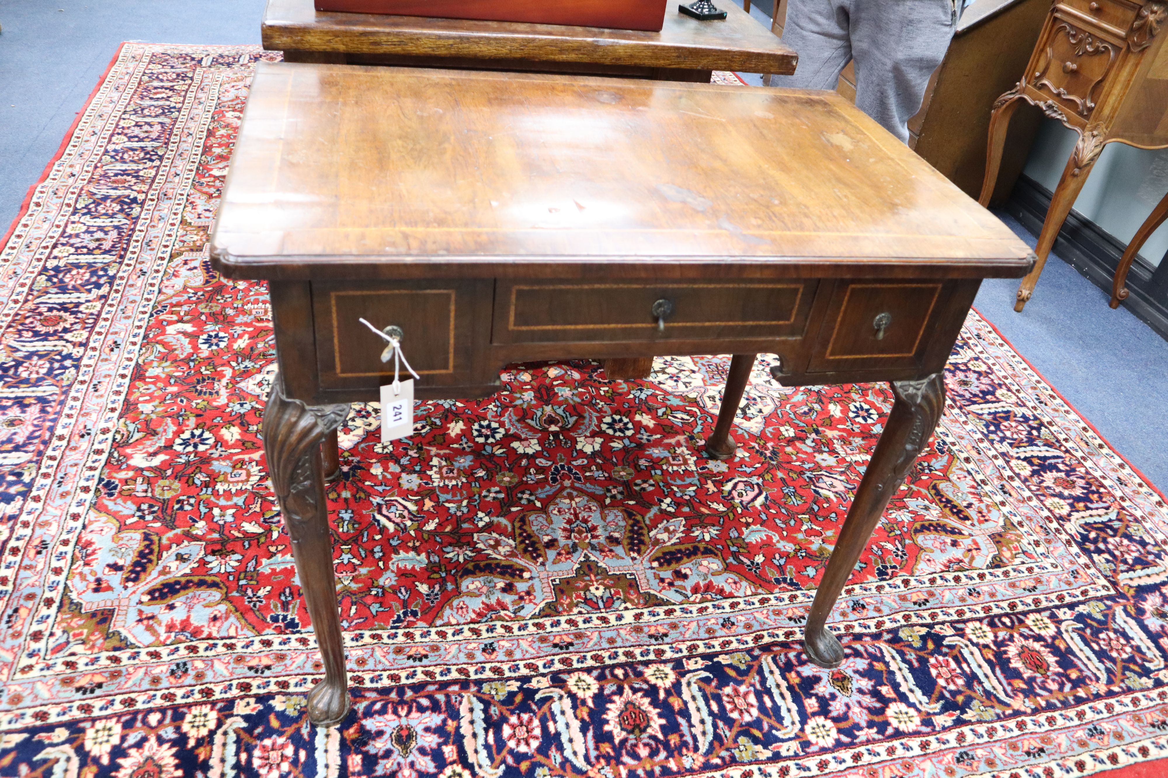 An 18th century feather banded walnut lowboy, width 86cm, depth 54cm, height 72cm